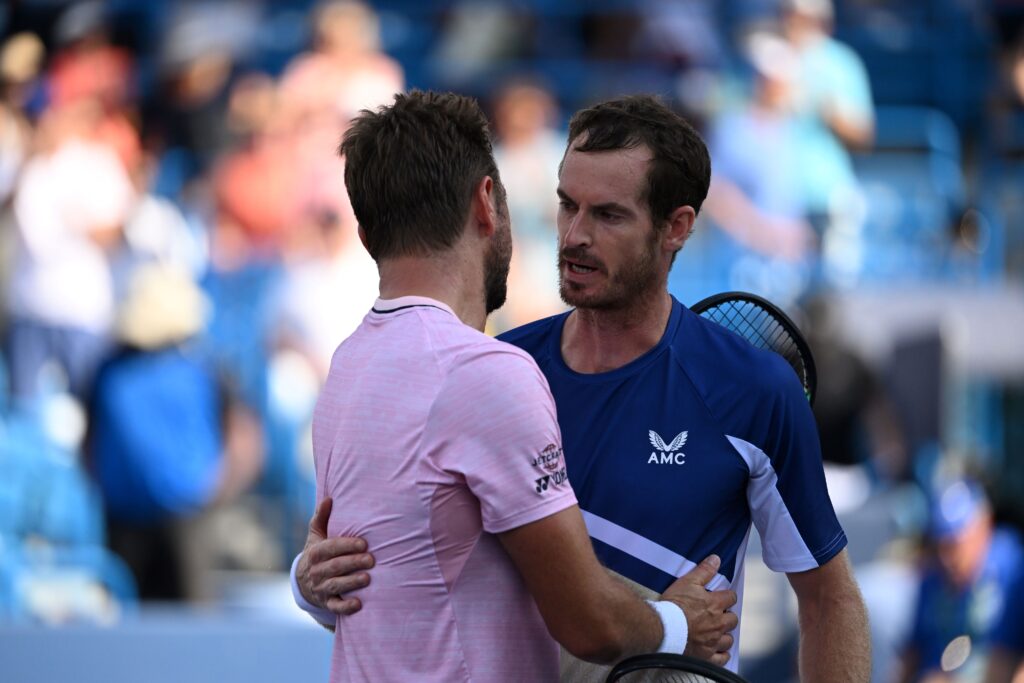 Andy Murray and Stan Wawrinka embracing at the net