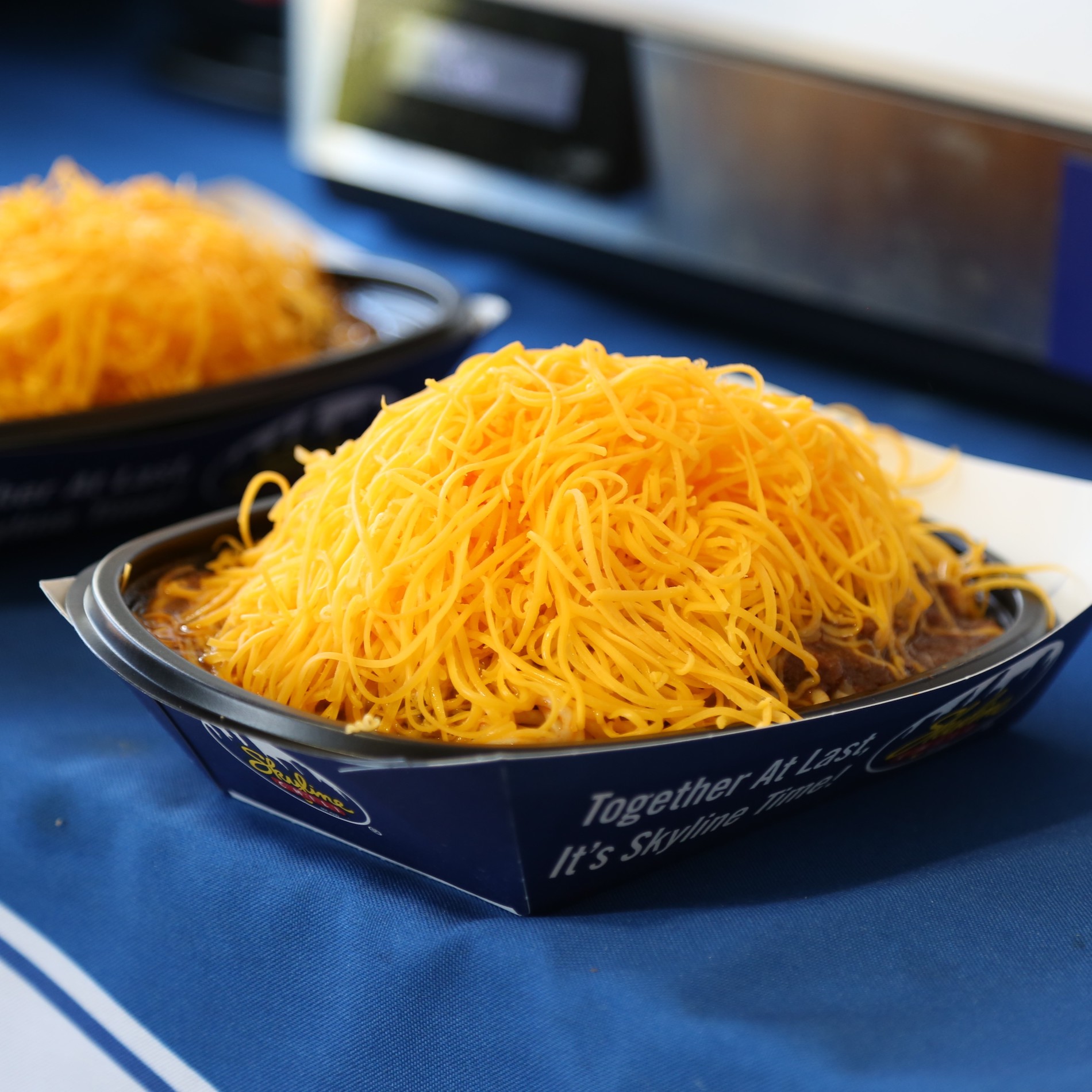 a bowl of Chili topped with cheese