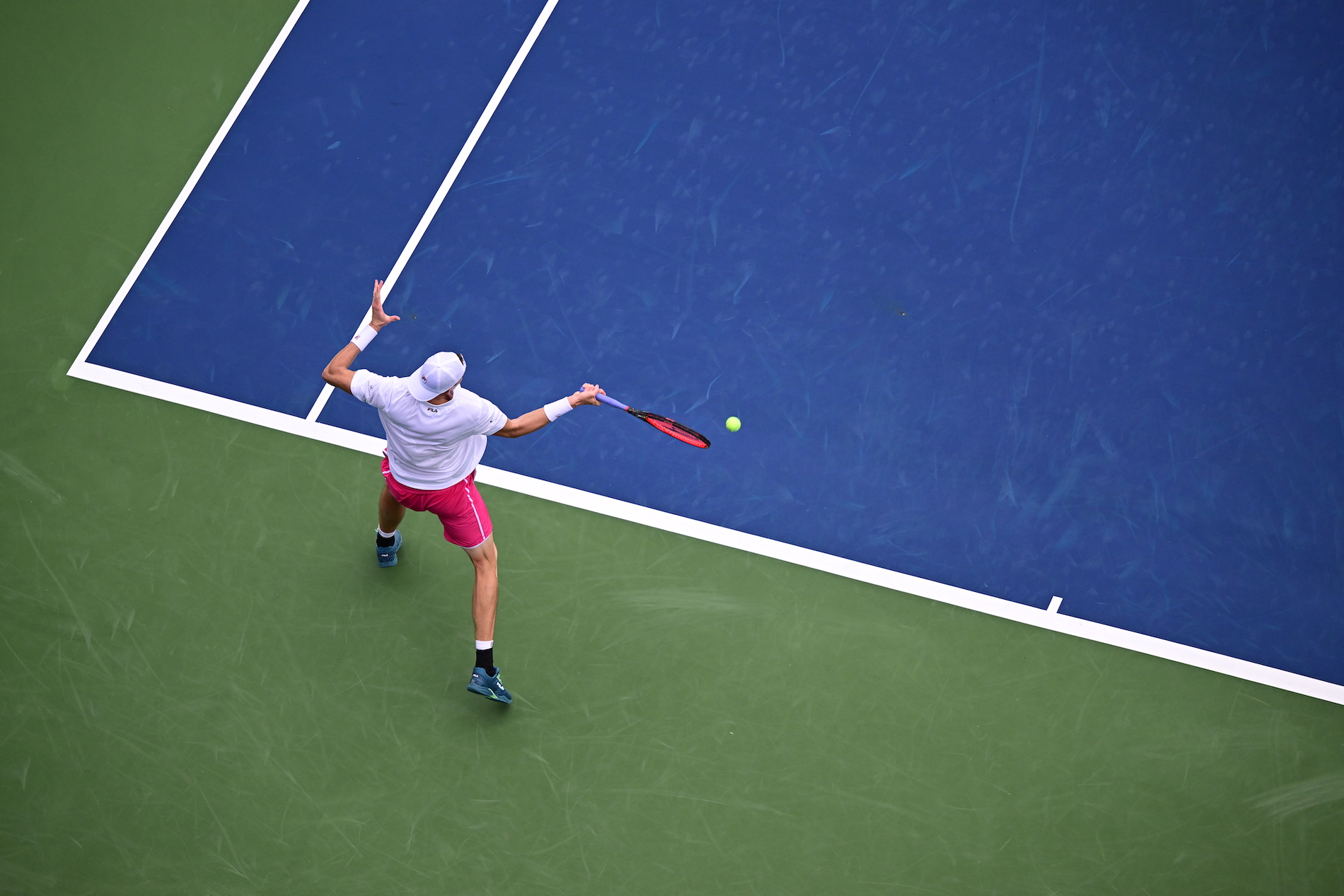 aerial view of tennis playing mid match