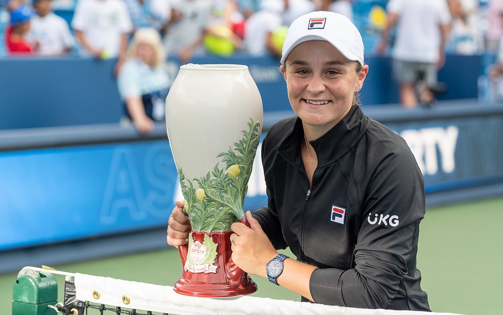 woman posing with trophy