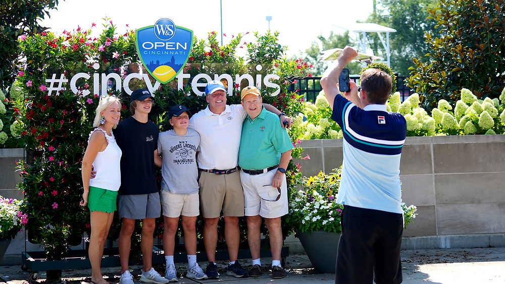 A group photo in front of the sign at the Western & Southern Open in Cincinnati.