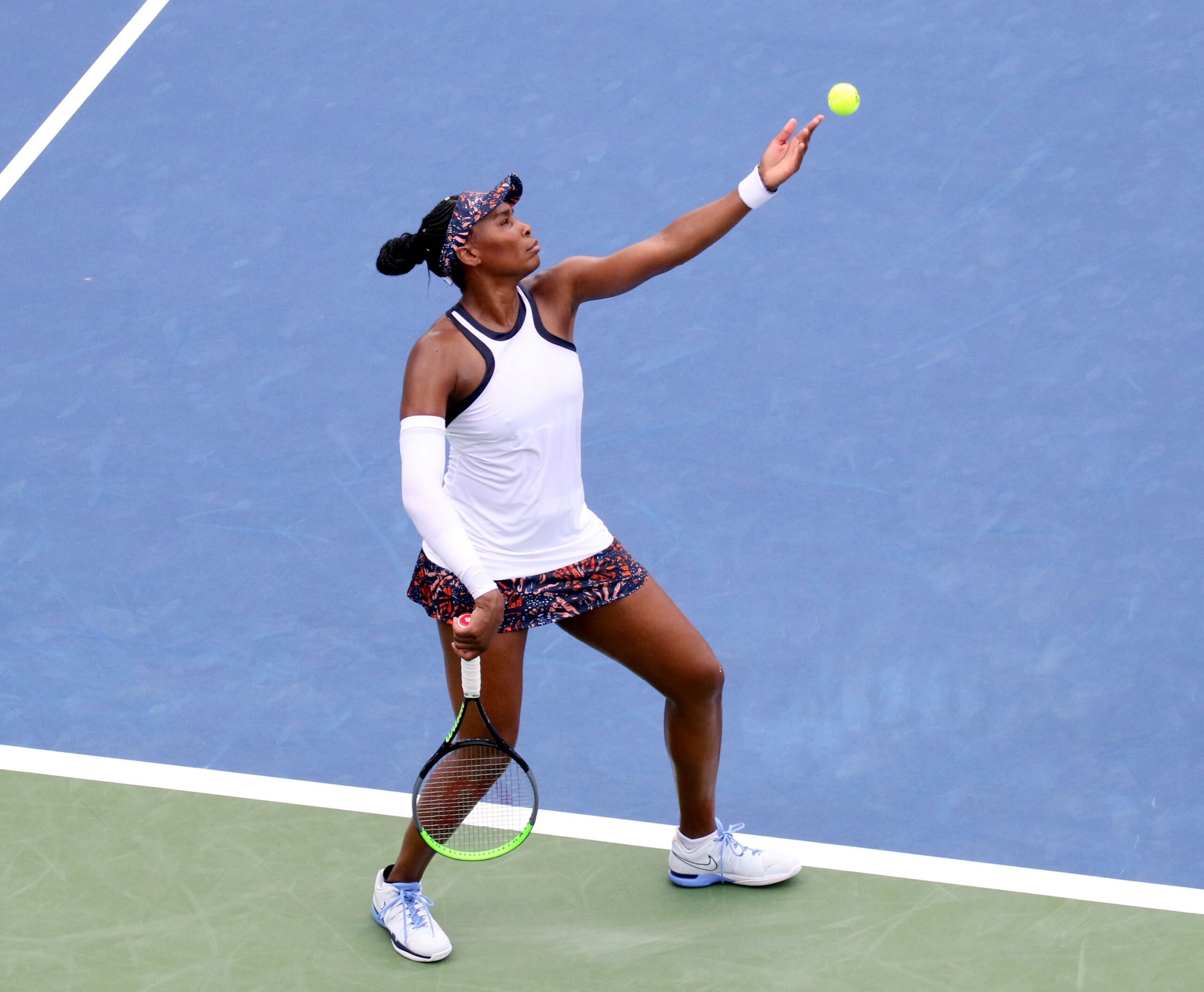 Venus Williams prepares to hit a serve on court