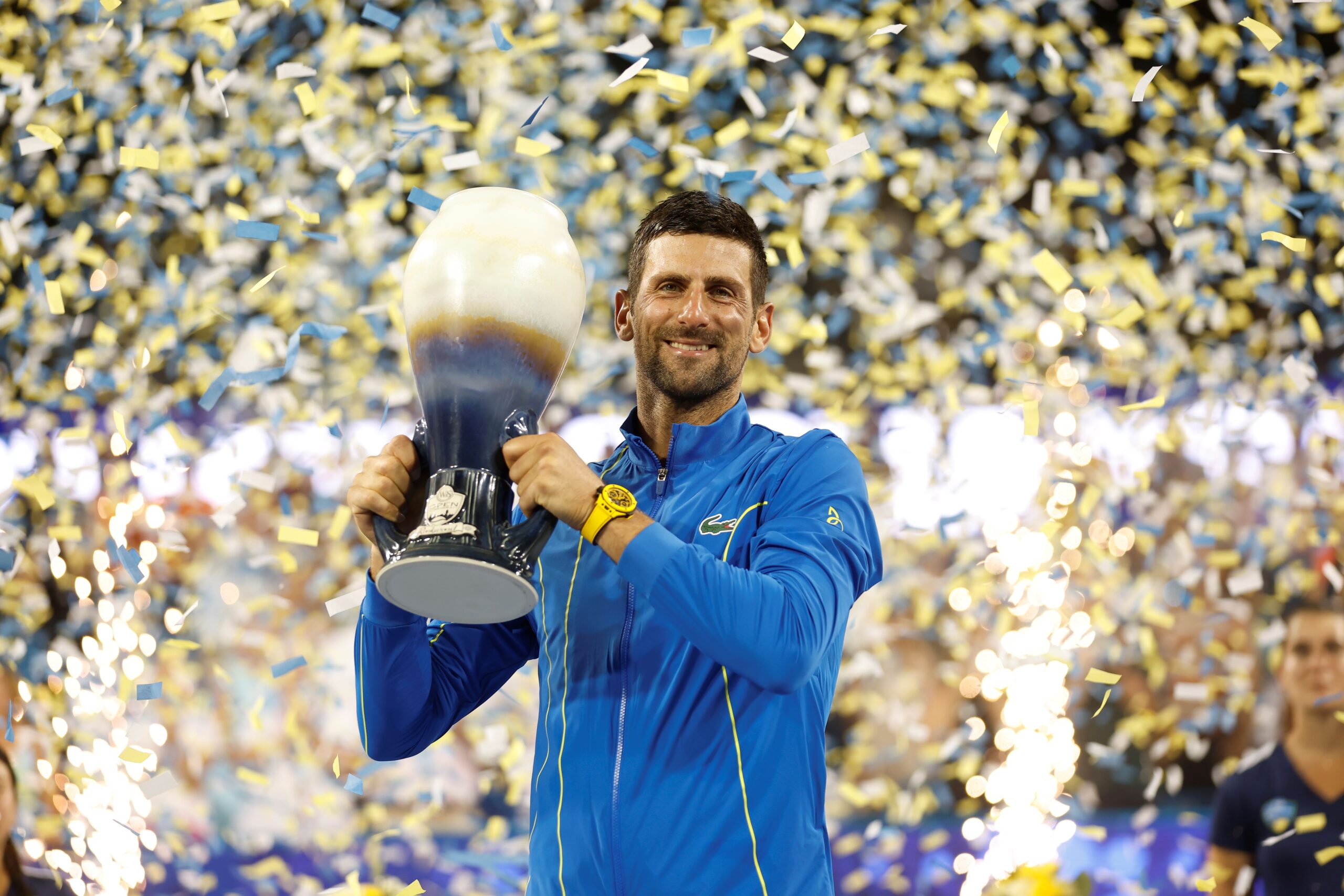 Novak Djokovic hoists a trophy