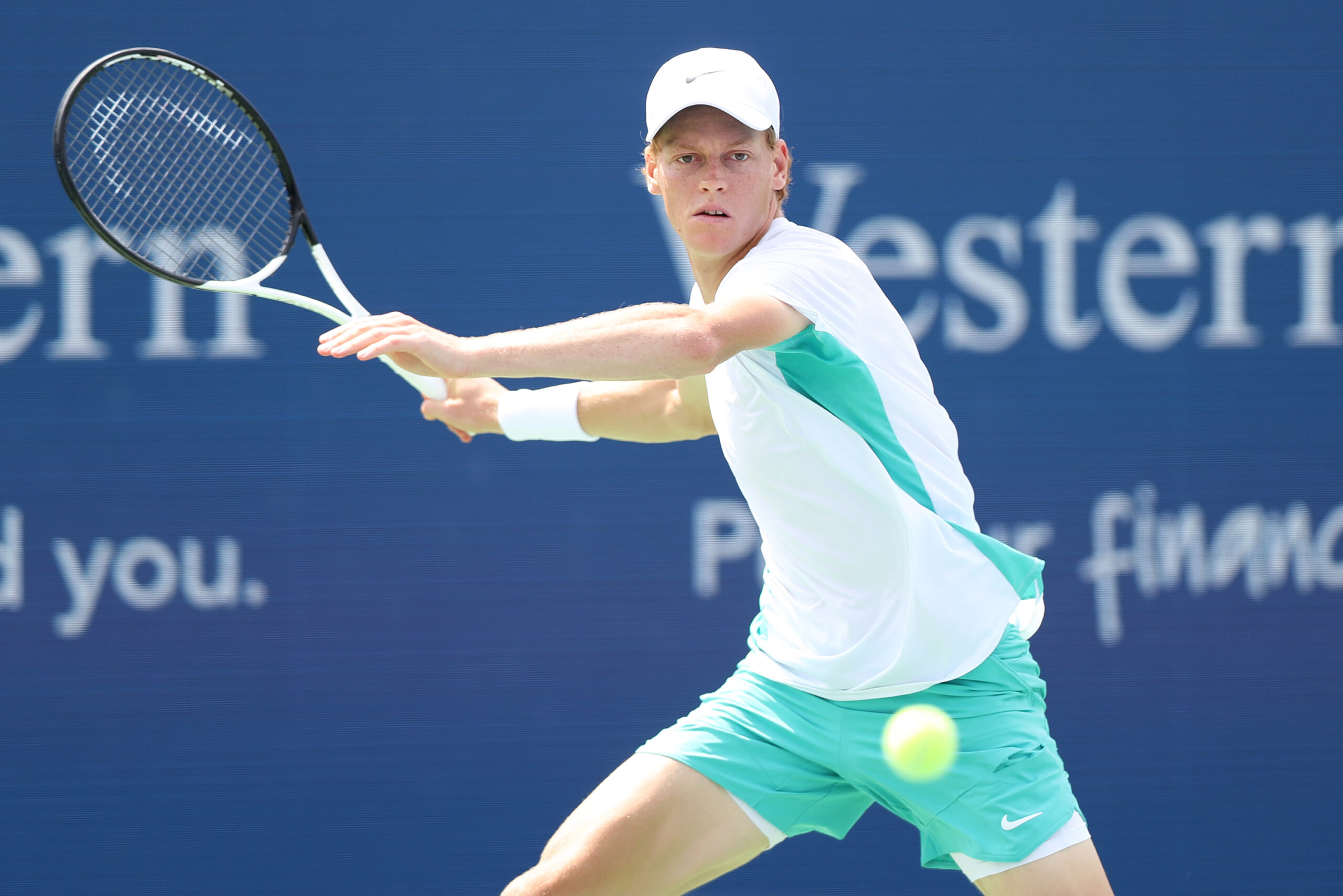 Jannik Sinner getting ready to hit a forehand