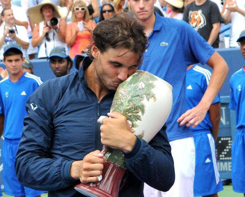 Rafael Nadal kissing a trophy