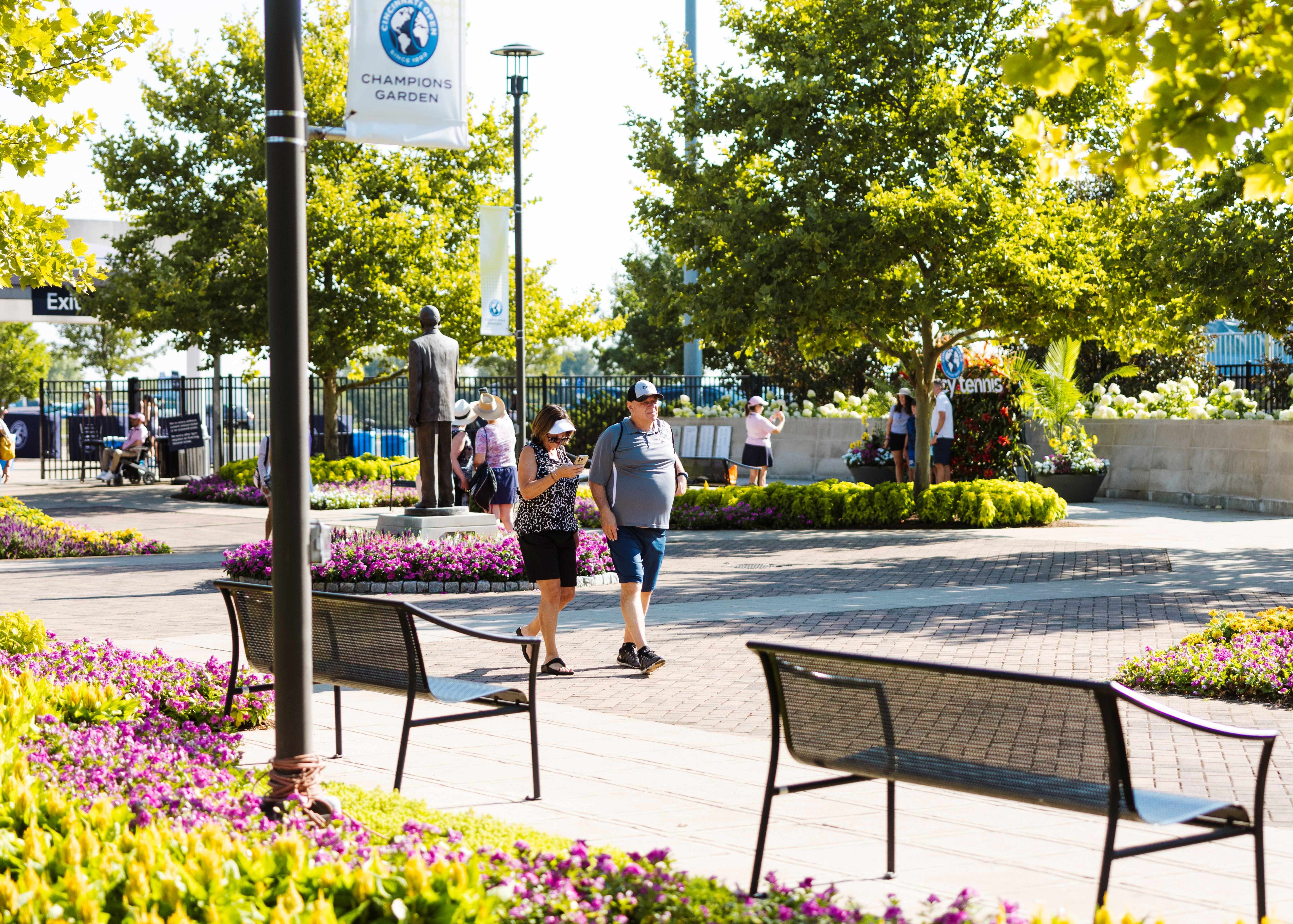 People walk through landscaping