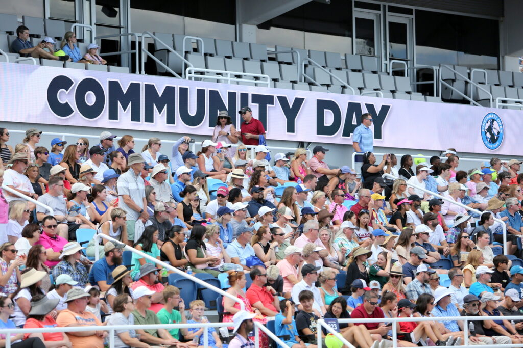 Crowd in the bleachers for community day.