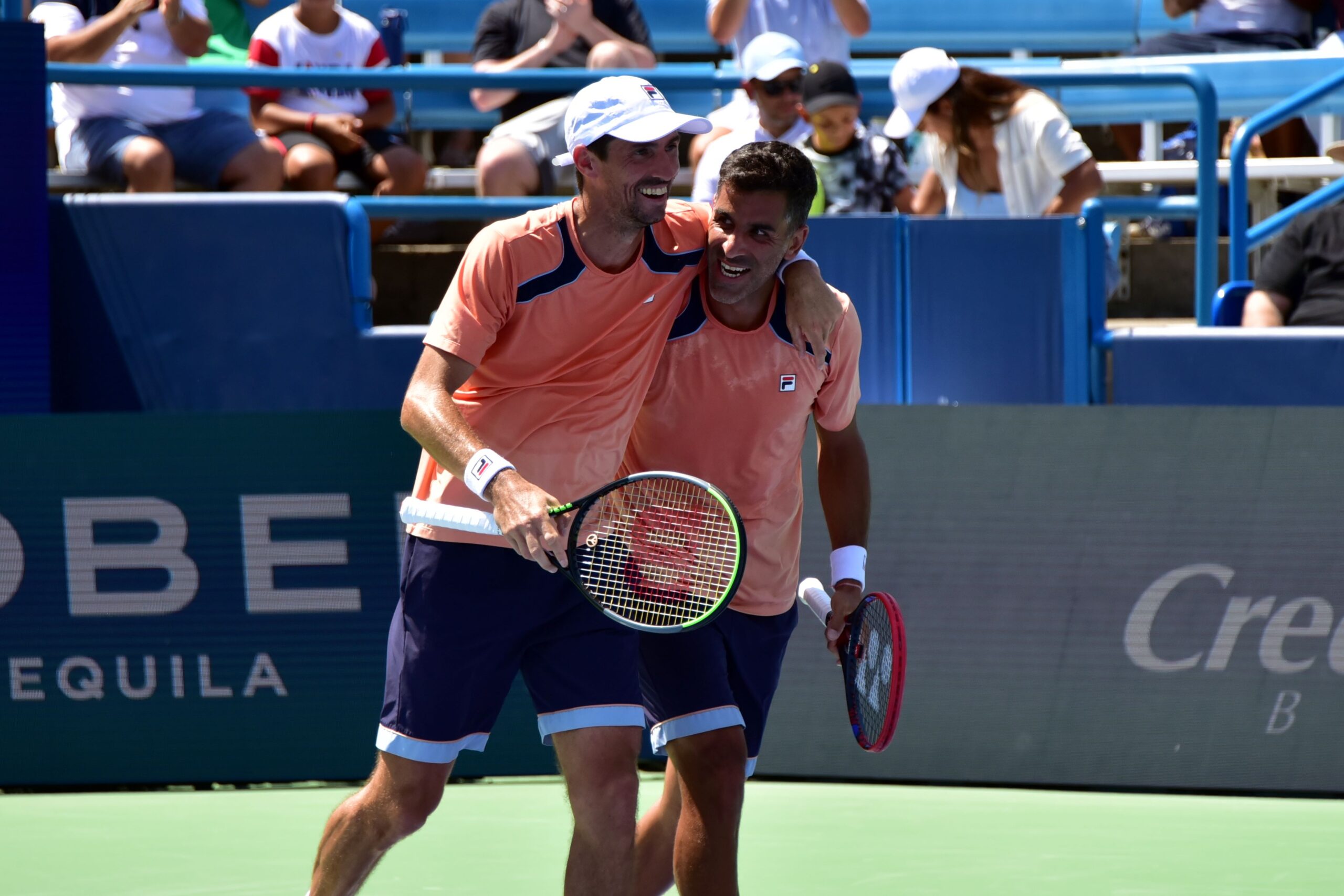 Maximo Gonzalez and Andres Molteni laugh together