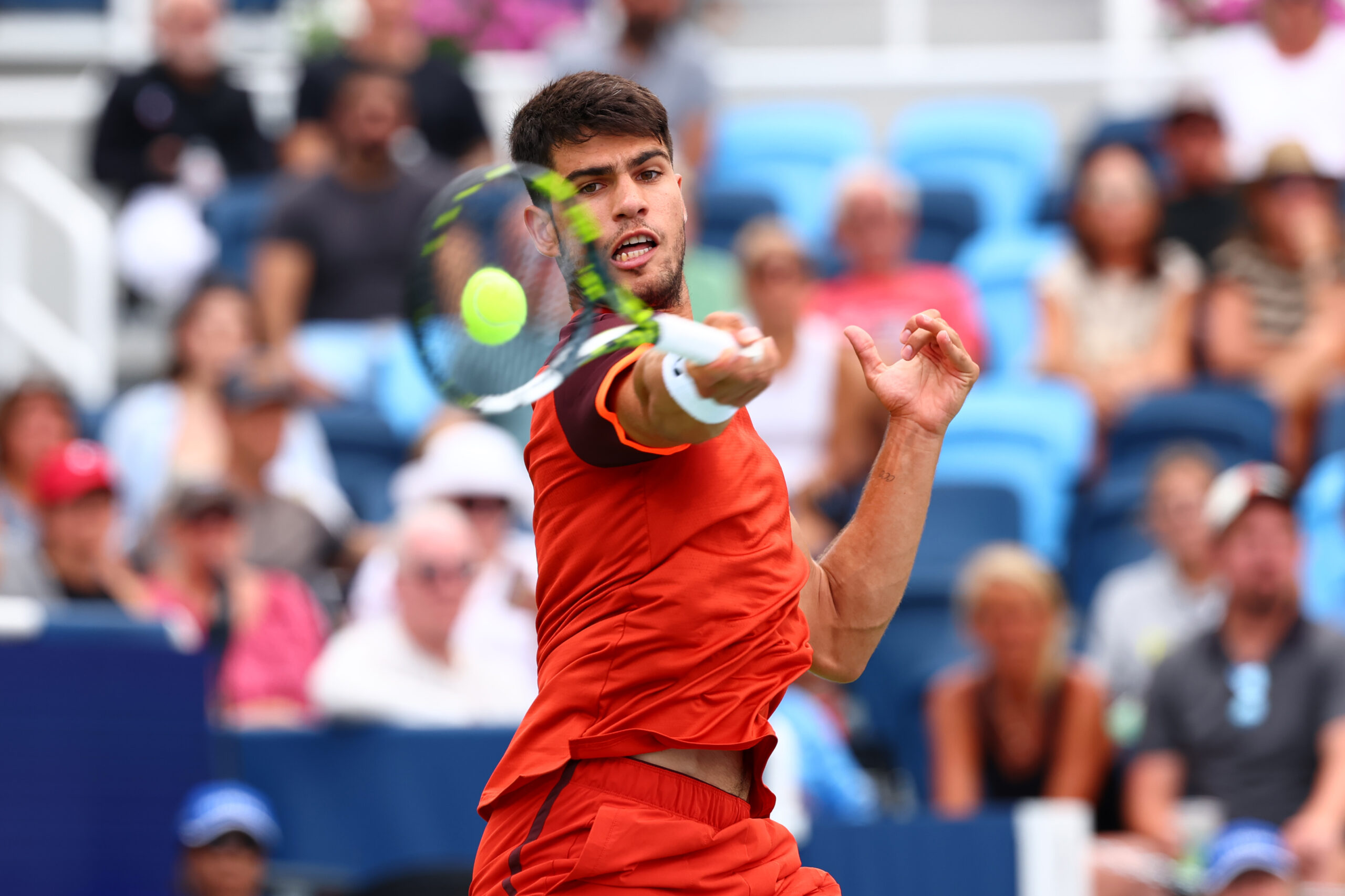 Carlos Alcaraz hits a tennis ball