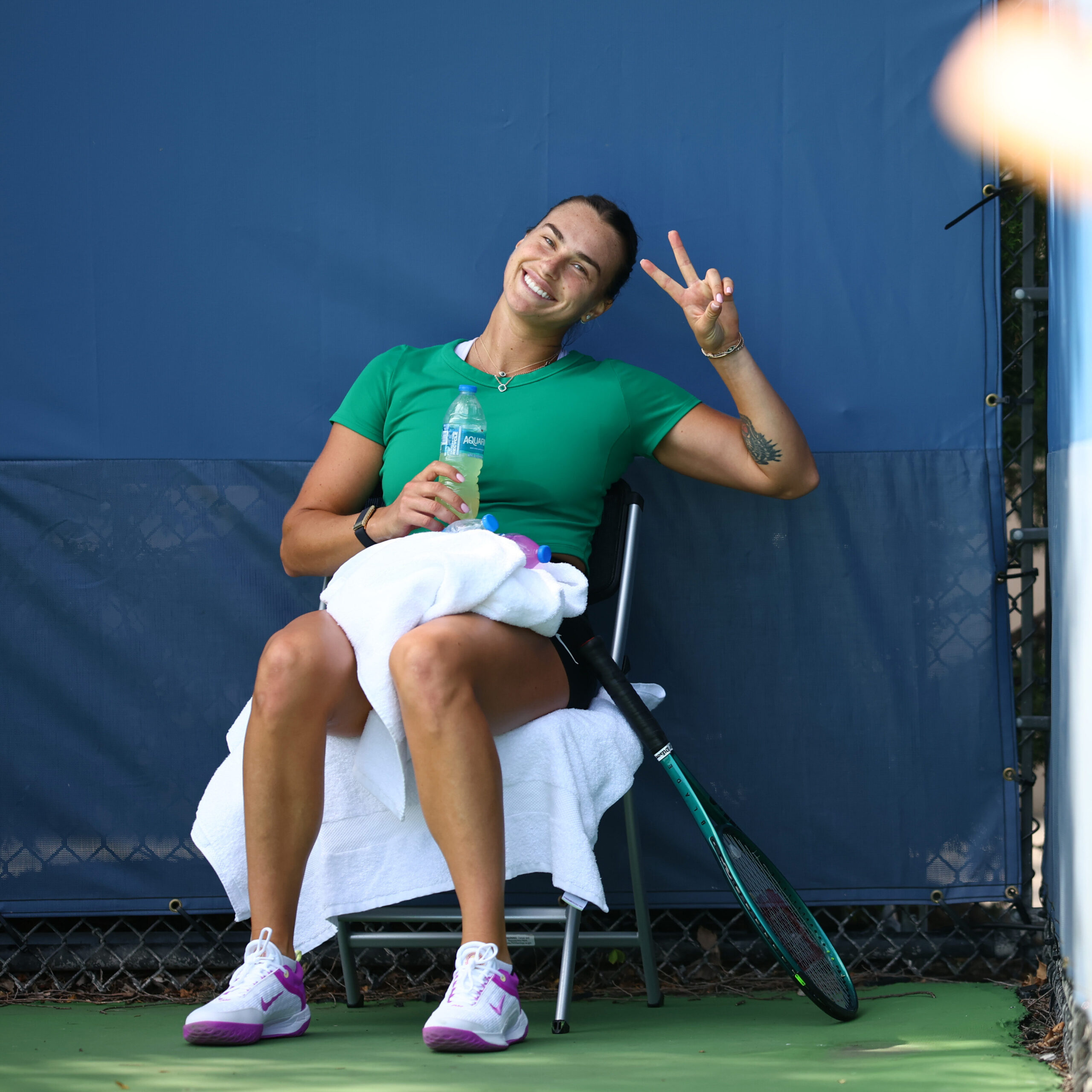 Aryna Sabalenka having fun on a practice court.