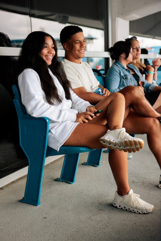 Couple smiles in the stands