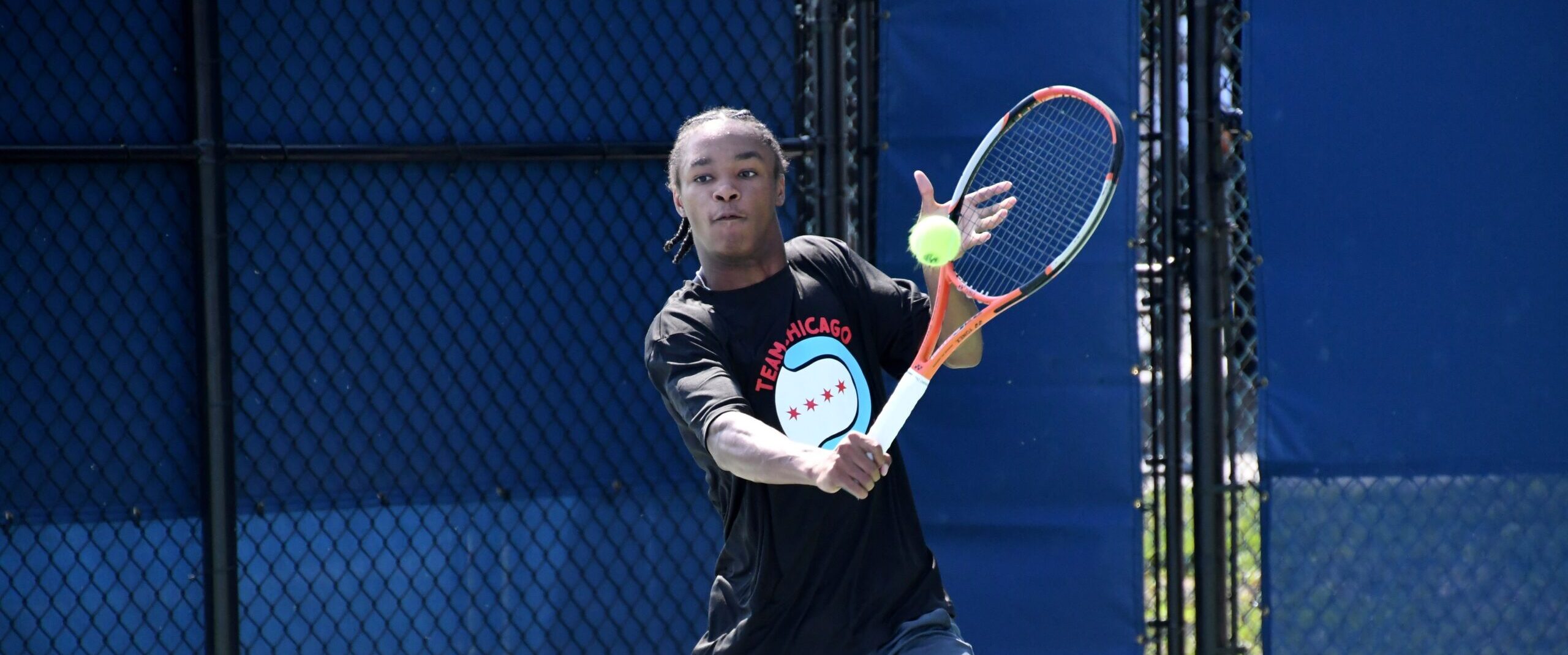 Tennis player hits a backhand volley