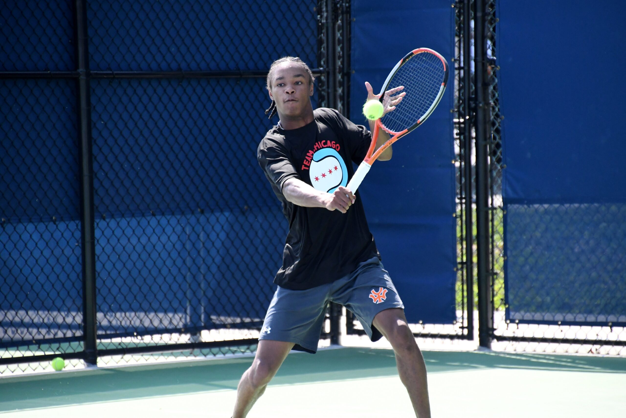 Tennis player hits a backhand volley