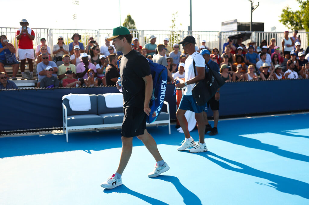 Ben Shelton walking on the court