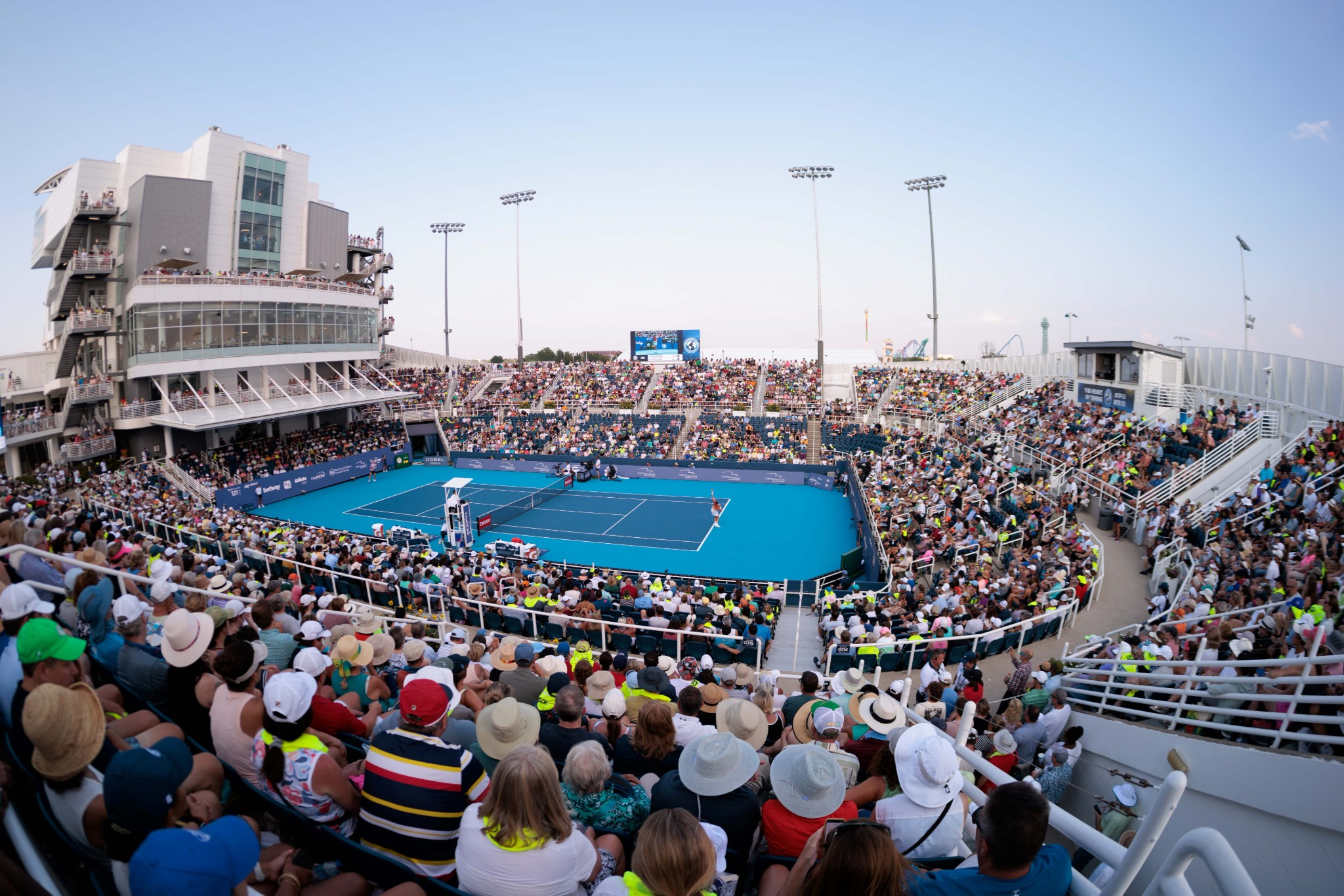Wide shot view of a match on grandstand court