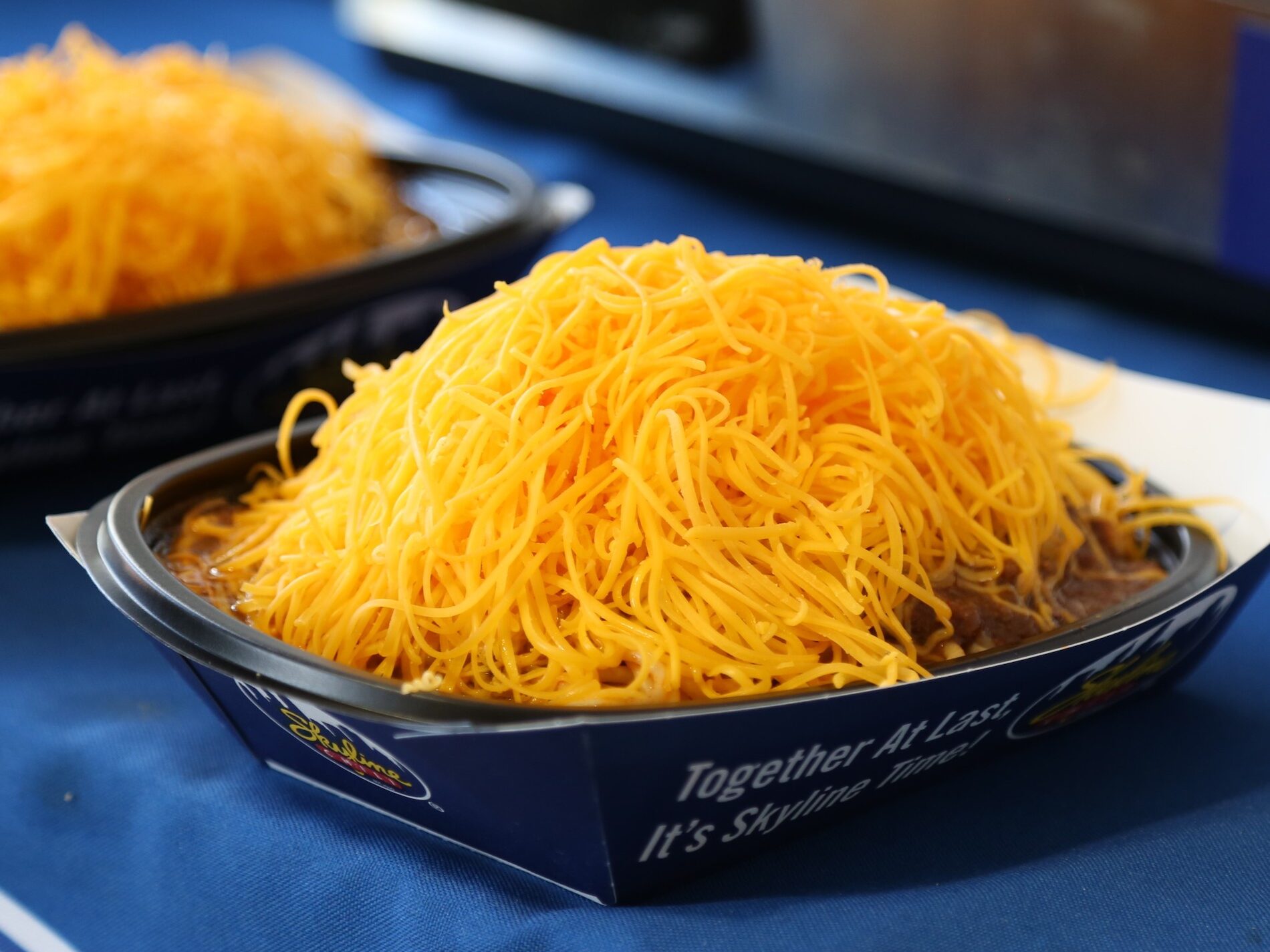 a bowl of Chili topped with cheese
